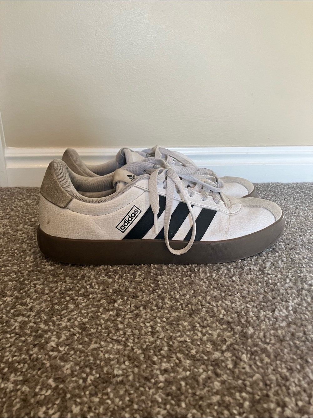 adidas Men’s Off-White Canvas Sneakers with Black Stripes